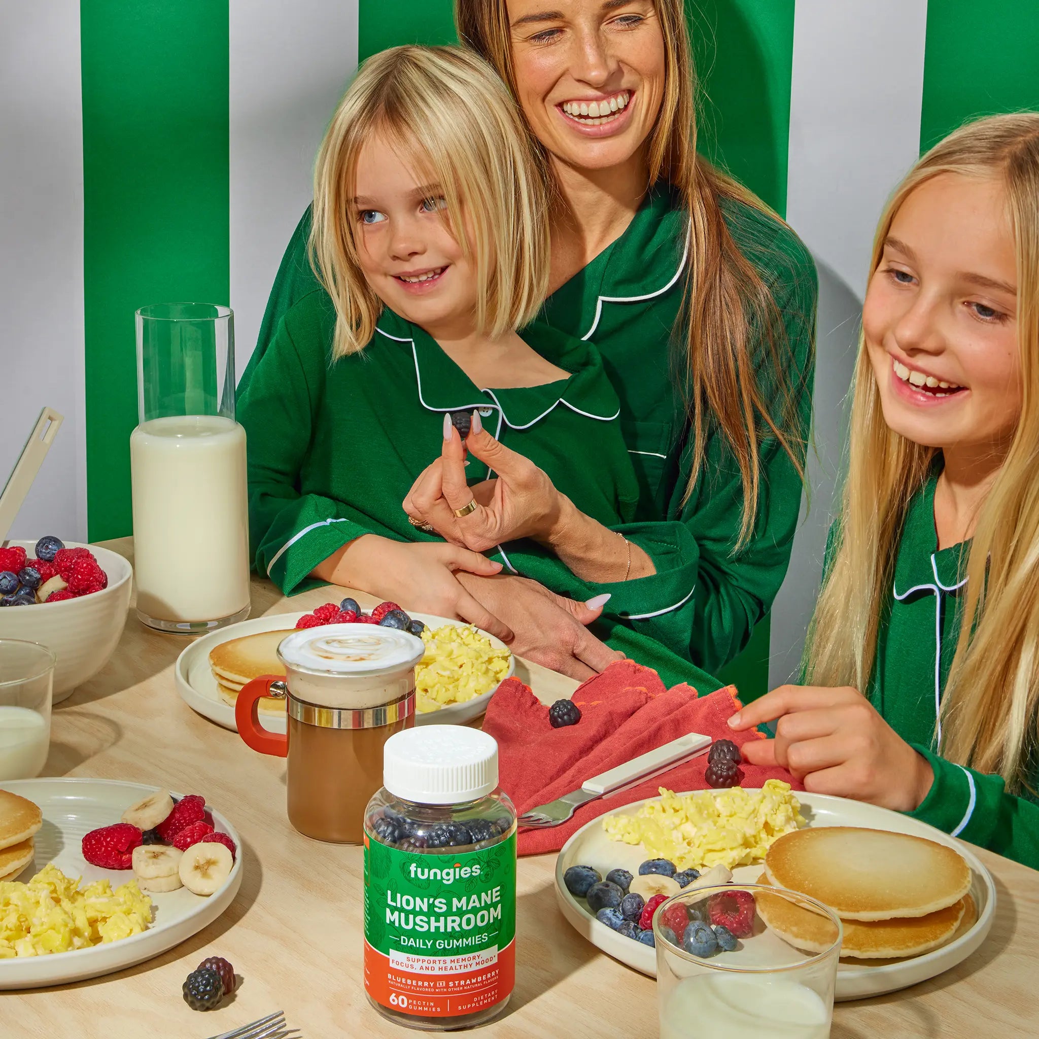 Family enjoying breakfast with Fungies Lion's Mane Mushroom Gummies (60 Count) on table, surrounded by pancakes, berries, milk, and coffee, highlighting a health-focused start to the day.