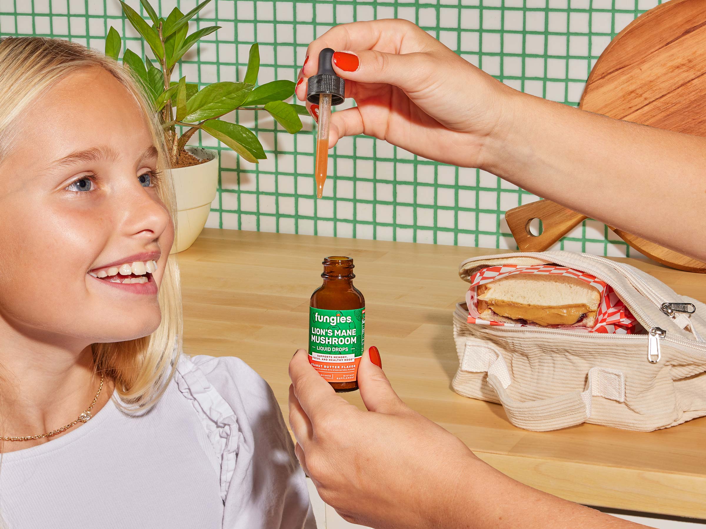 Young girl with lion's mane liquid drops from fungies